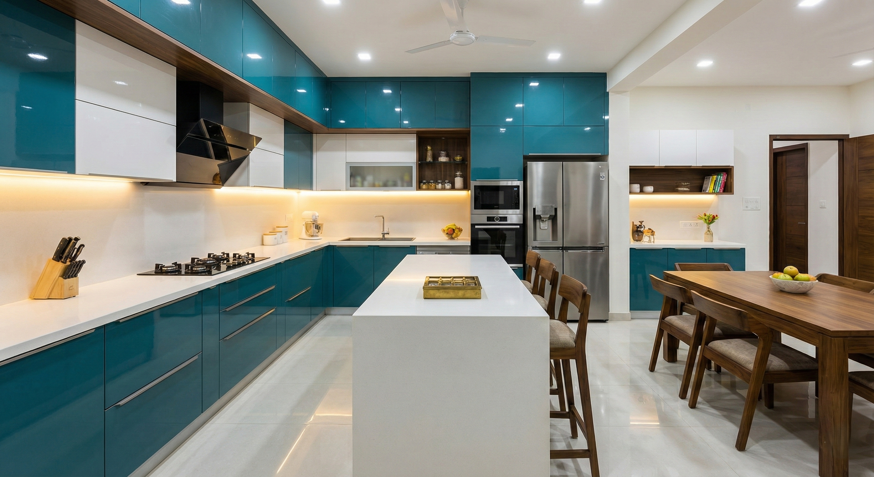 A bright and modern L-shaped kitchen with white cabinets and wooden accents.